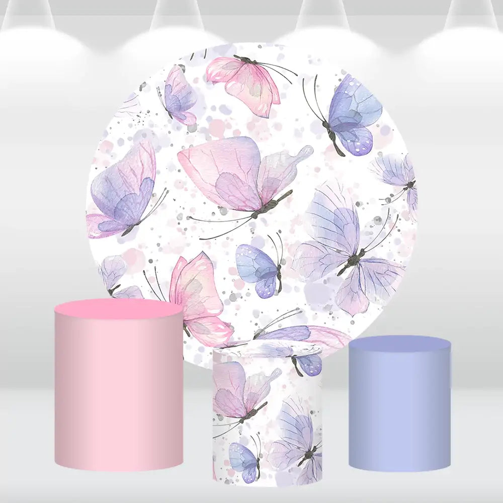 Butterfly-themed round backdrop with pastel watercolor designs and matching pink and blue cylinder covers, ideal for elegant party decorations.