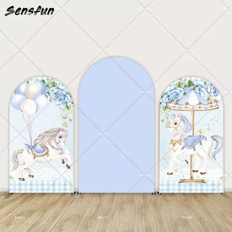 Elegant carousel horse backdrops in soft blue with floral accents, perfect for a baby shower or birthday celebration