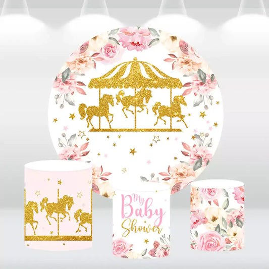 Elegant carousel-themed baby shower backdrop with gold glitter carousel horses, surrounded by floral accents, paired with three matching cylindrical pedestal covers featuring carousel and floral designs.