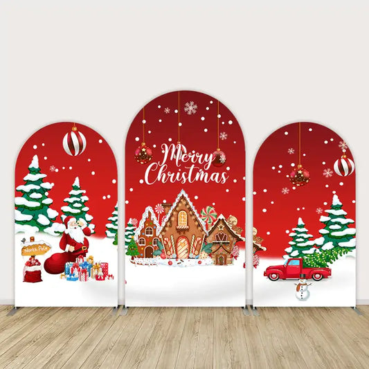 Three-panel Christmas arch backdrop with Santa Claus, gingerbread houses, snow-covered trees, red truck, ornaments, and “Merry Christmas” text.