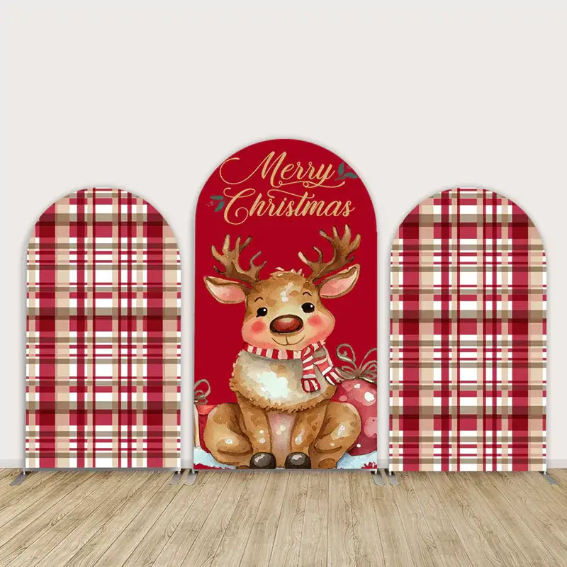 Three-panel Christmas arch backdrop set featuring a cute cartoon reindeer in the center with “Merry Christmas” text and red buffalo plaid side panels.