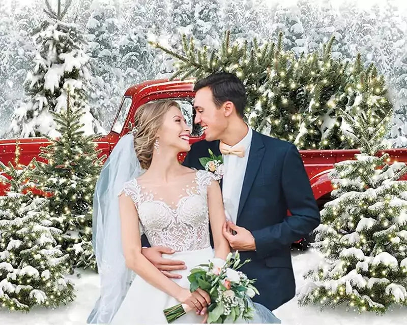 Christmas scene backdrop with a red truck carrying a Christmas tree in a snowy forest, perfect for holiday photos.