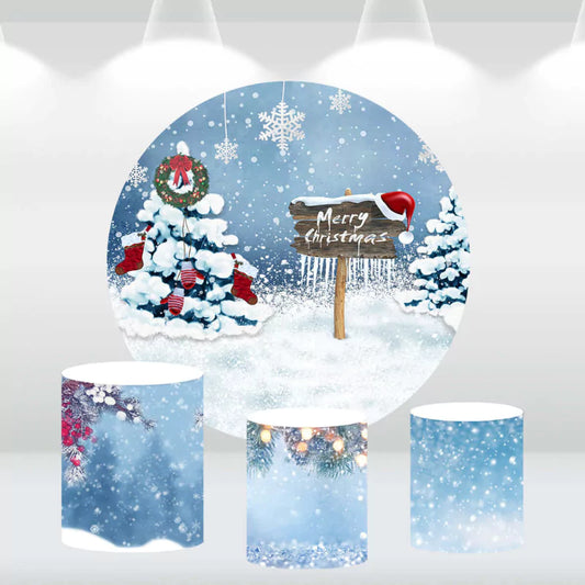 Christmas-themed round backdrop featuring a snowy scene with decorated Christmas trees, stockings, and a 'Merry Christmas' sign, paired with three matching cylindrical covers with winter designs.