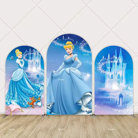 Three-panel arch backdrop set featuring Cinderella in her blue gown, with sparkling castles and magical elements in the background.