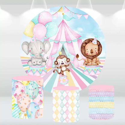 Circus-themed round backdrop with an elephant, monkey, and lion, paired with three matching cylindrical pedestal covers featuring balloon, diamond, and pastel designs.