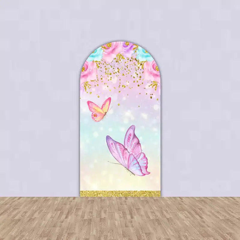 Whimsical arch backdrop with pink and purple butterflies, floral accents, and glitter details, suitable for butterfly-themed birthday parties.