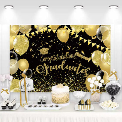 Graduation party backdrop with golden balloons, confetti, and graduation cap – perfect for celebrating graduates with a festive black and gold design