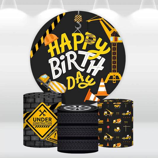 Construction-themed round backdrop with a Happy Birthday design and matching cylinder covers featuring construction equipment and caution signs, ideal for kids' parties.