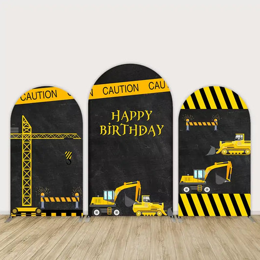 Three-panel construction-themed birthday arch backdrop with caution tape, diggers, bulldozers, and “Happy Birthday” text on chalkboard-style background.