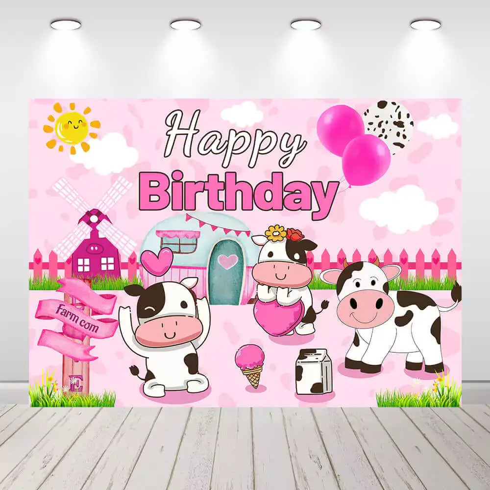 Pink cow-themed birthday party backdrop with cows, balloons, and a farm setting, perfect for kids' birthday parties.