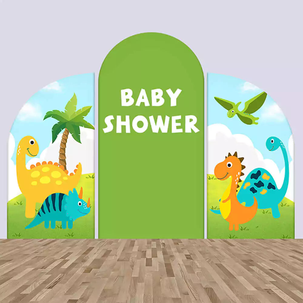 Dinosaur-themed arched backdrop set for a baby shower featuring colorful cartoon dinosaurs, palm trees, and a bold 'Baby Shower' text.