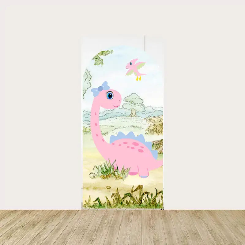 Pink cartoon dinosaur with a bow, standing in a grassy prehistoric setting with trees and sky in the background, ideal for a playful kids’ party.