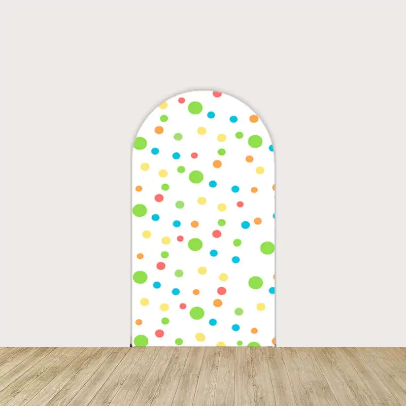 White backdrop with multicolored polka dots, complementing the dinosaur theme with a bright and cheerful design.