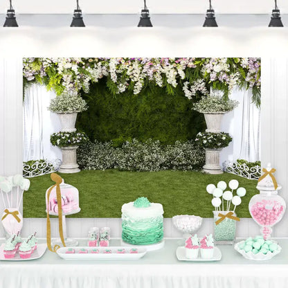 Elegant garden-themed backdrop with floral arrangements and greenery, perfect for weddings and formal events.