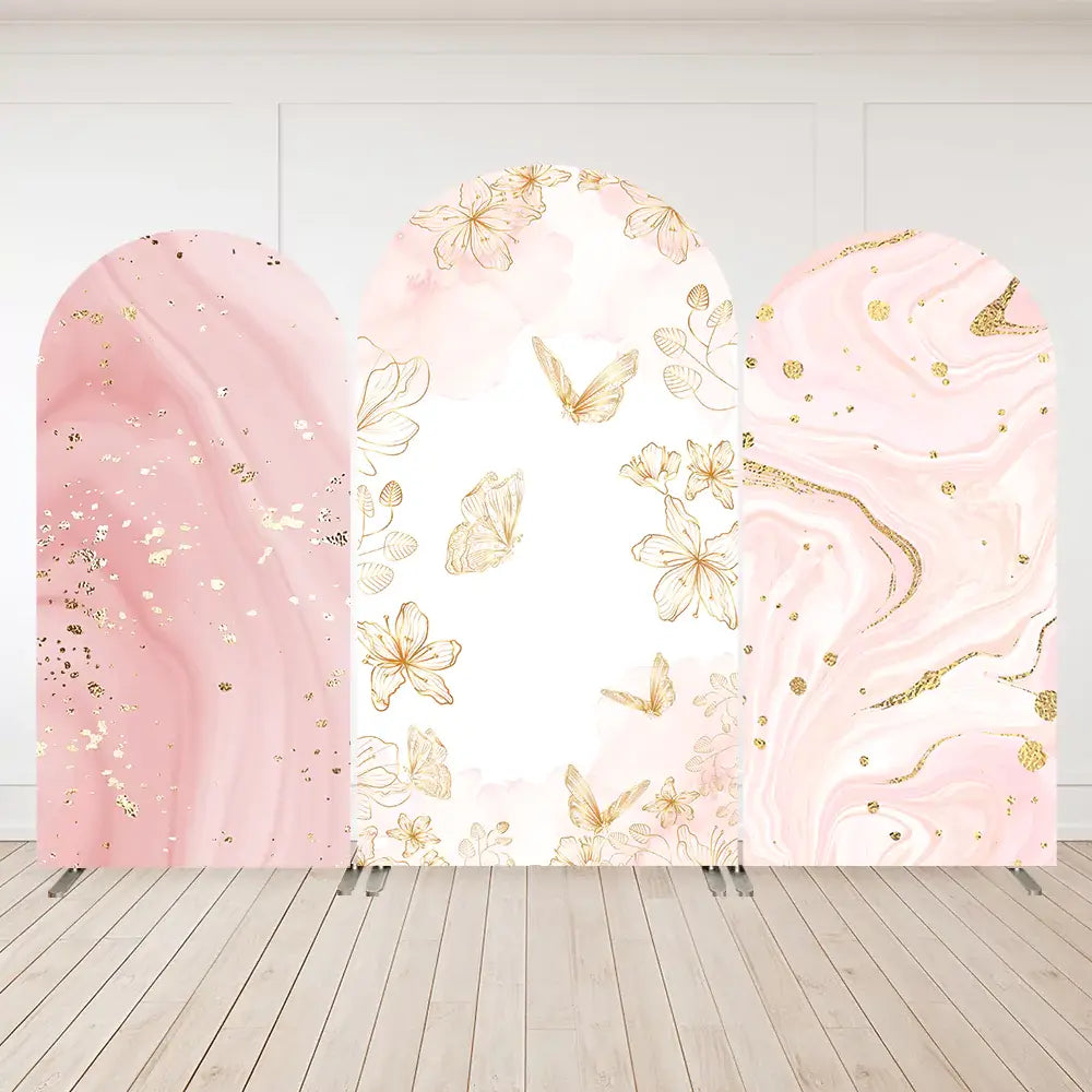 Elegant pink and gold backdrop with marbled texture, golden floral accents, and butterflies for a luxury event or wedding decor