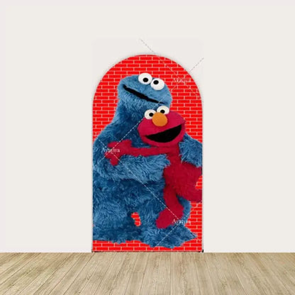 Arched backdrop featuring Cookie Monster holding Elmo against a red brick background, perfect for a Sesame Street-themed kids’ party.