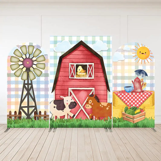 Farm-themed three-panel arch backdrop set featuring a red barn, windmill, cow, horse, chick, picnic table, sun, and crate of vegetables—perfect for kids’ farm birthday party.