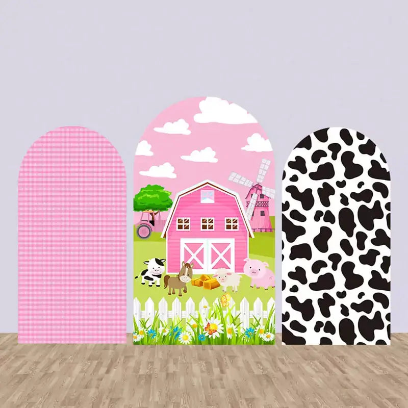 Set of three farm-themed arched backdrops featuring a pink gingham pattern, a pink barn with animals, and a black and white cow print, ideal for a farm-themed birthday party.