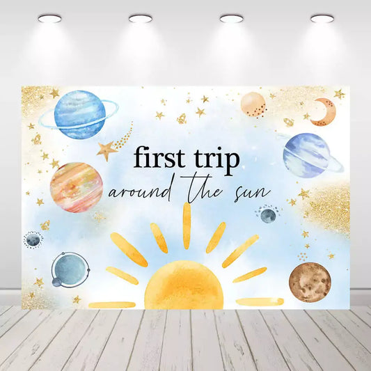 Space-themed first birthday backdrop with "First Trip Around the Sun" text and planets, perfect for 1st birthday celebrations.