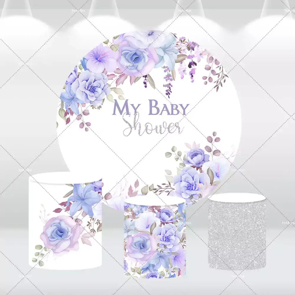 Lavender floral baby shower backdrop with matching cylinder covers in silver and floral designs