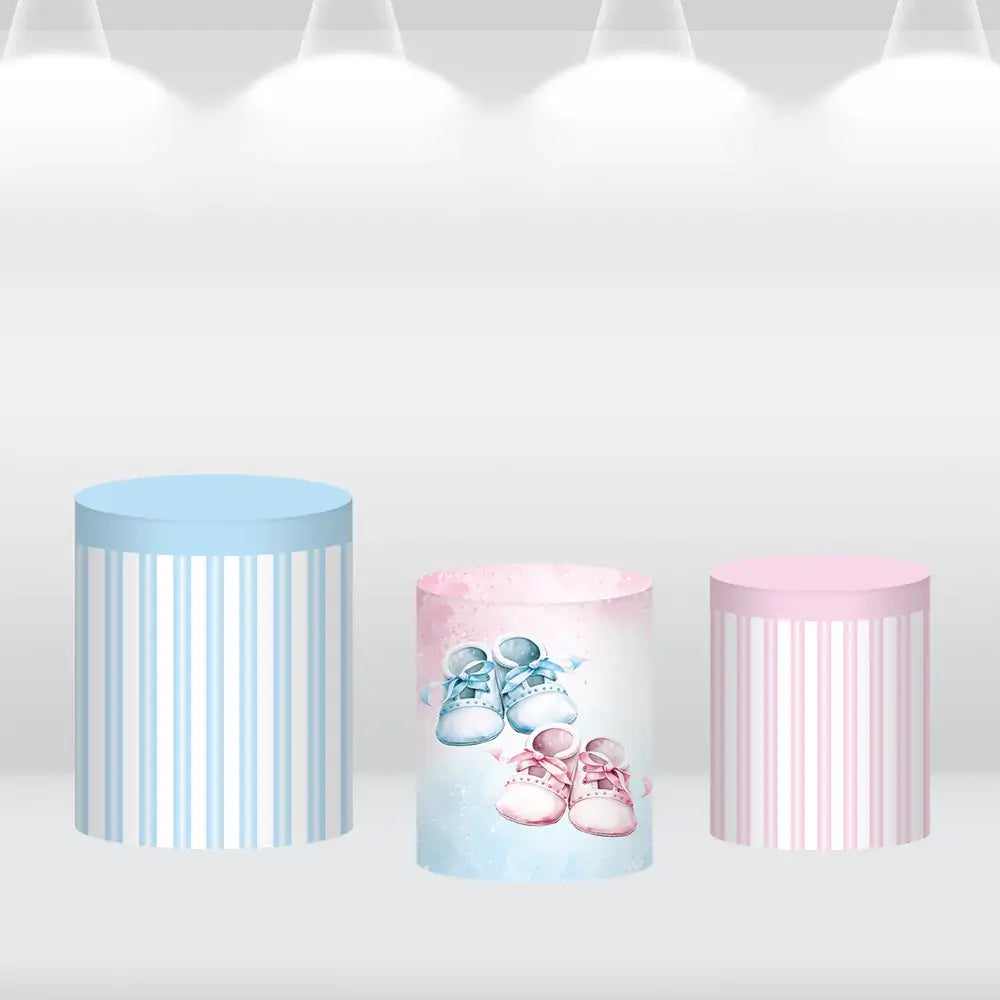 Cylinder cover featuring blue and pink baby shoe illustrations, complementing the Oh Baby backdrop theme for event decor.