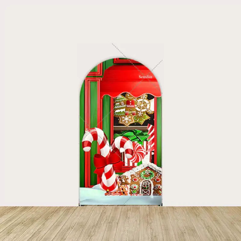 Candy canes and gingerbread window display with holiday bows and gifts.