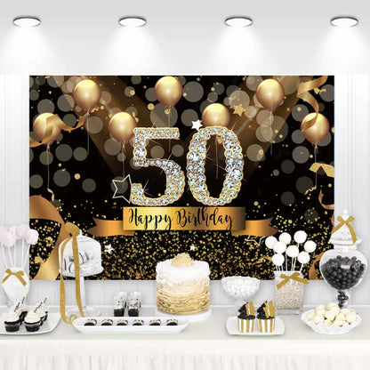 Golden 50th birthday backdrop with balloons and glitter.