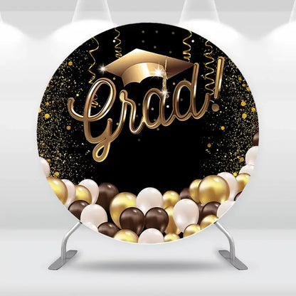Round graduation backdrop with gold grad cap, black and gold confetti, and balloon border – perfect for high school or college graduation parties
