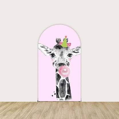 Pink backdrop featuring a giraffe blowing a bubble gum bubble and wearing a party hat, adding a whimsical and humorous touch to the safari theme.