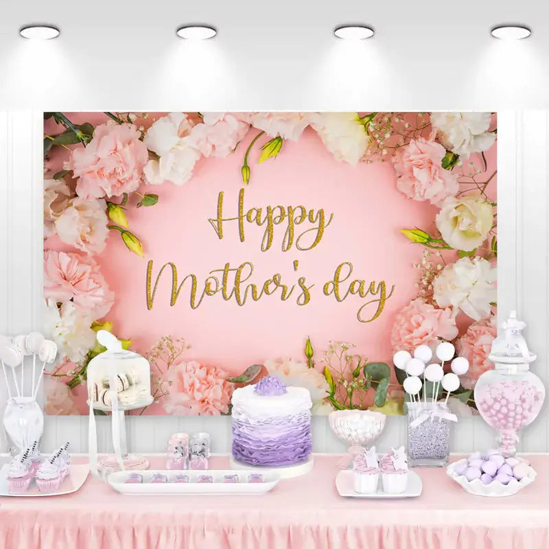 Beautiful Mother's Day celebration backdrop featuring soft pink flowers and elegant gold script on a pale pink background, perfect for honoring mothers.