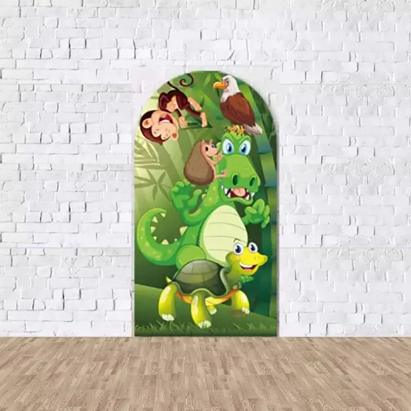 Arched backdrop with a green crocodile, turtle, monkeys, and tropical foliage for jungle-themed decorations.