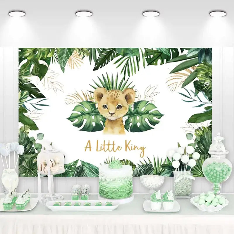 Baby shower backdrop depicting a cute lion cub with the text 'A Little King,' surrounded by dense tropical foliage, ideal for jungle-themed celebrations.