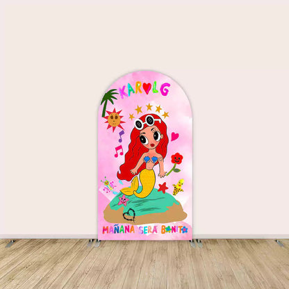 Center arch features red-haired mermaid on a rock with palm tree, stars, hearts, music notes, and “Mañana Será Bonito” text.