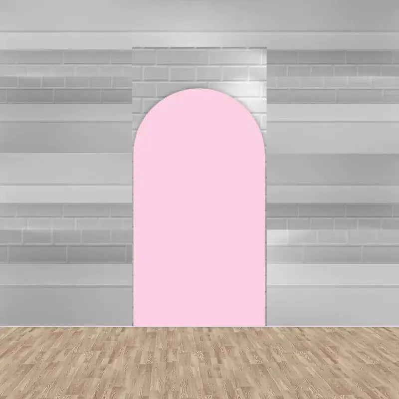 Simple arched backdrop in solid pastel pink, providing a soft and versatile background for various themed events.