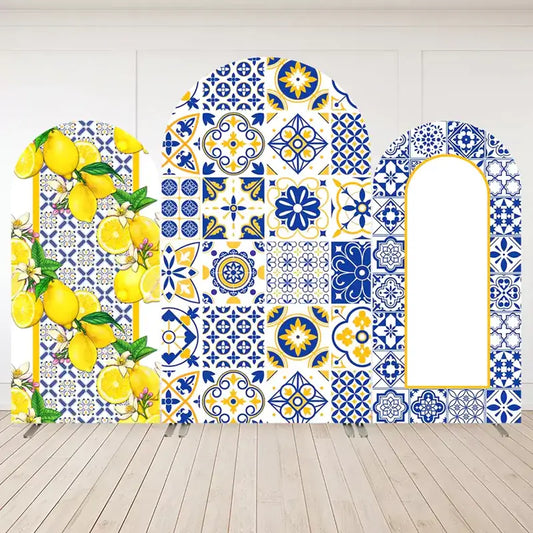 Three-panel Mediterranean arch backdrop set with bright yellow lemons, blue and white Italian tiles, and bold Amalfi Coast-inspired patterns.