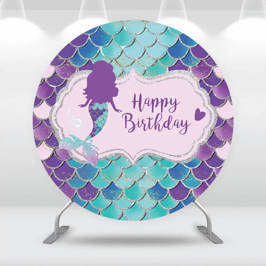 Mermaid-themed birthday backdrop with glittery scales, purple mermaid silhouette, and "Happy Birthday" text