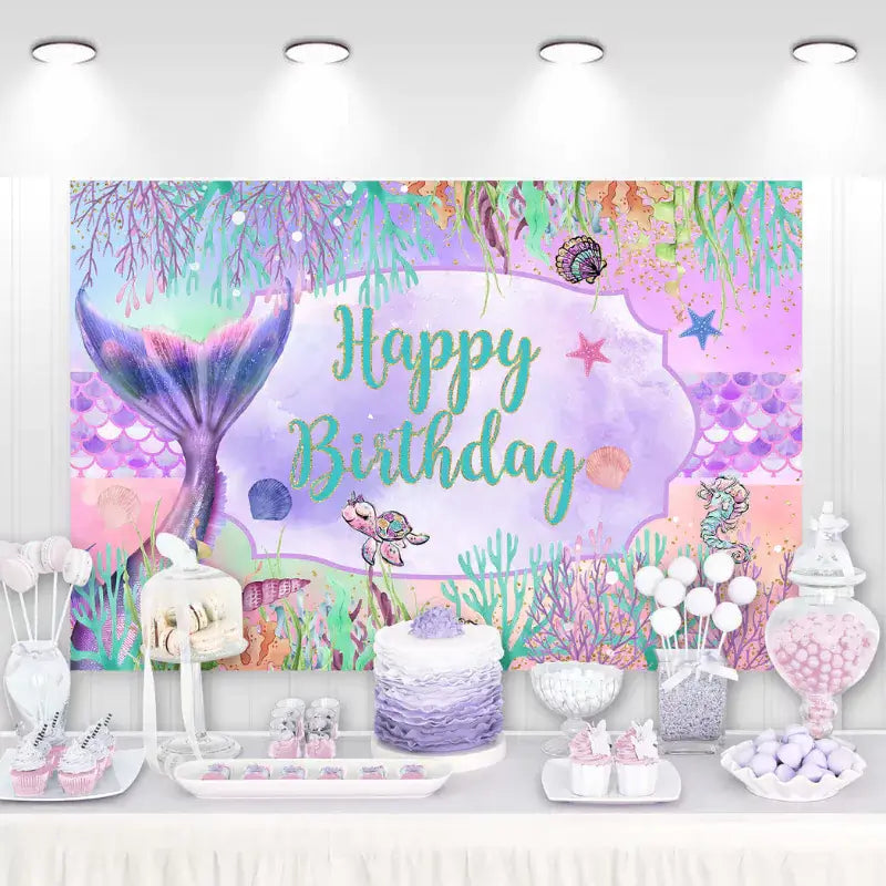 Mermaid-themed birthday backdrop with underwater elements, featuring a mermaid tail, sea creatures, and coral.