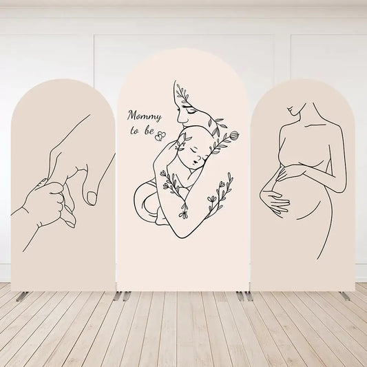 Three-panel minimalist baby shower arch backdrop with line drawings of pregnant woman, mother holding baby, and baby hand holding mom’s finger.