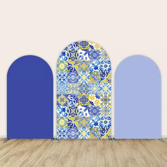 Three-panel arch backdrop set with Mediterranean-style blue and yellow tile center flanked by solid royal and light blue panels.