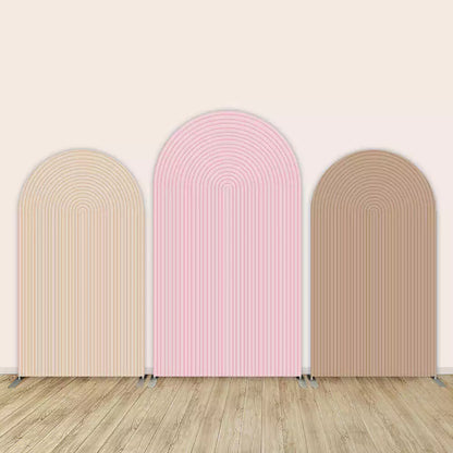 Three minimalist Chiara arch backdrops in nude beige, pastel pink, and cocoa brown with concentric groove patterns—ideal for modern baby showers or events.