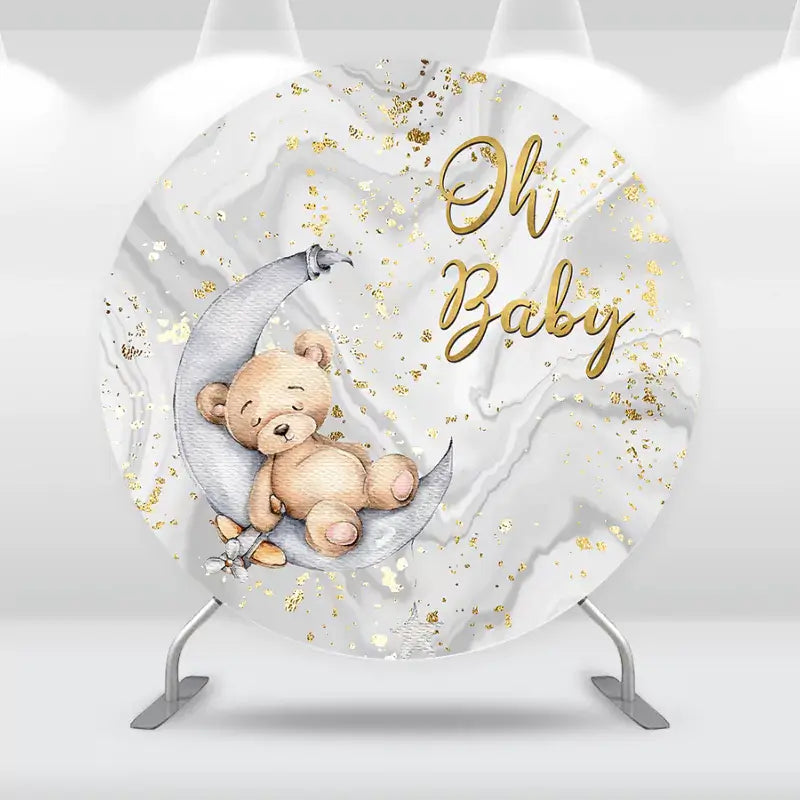 Round baby shower backdrop with a sleeping teddy bear on a crescent moon, marble texture background, and gold foil splatter – ‘Oh Baby’ text in script