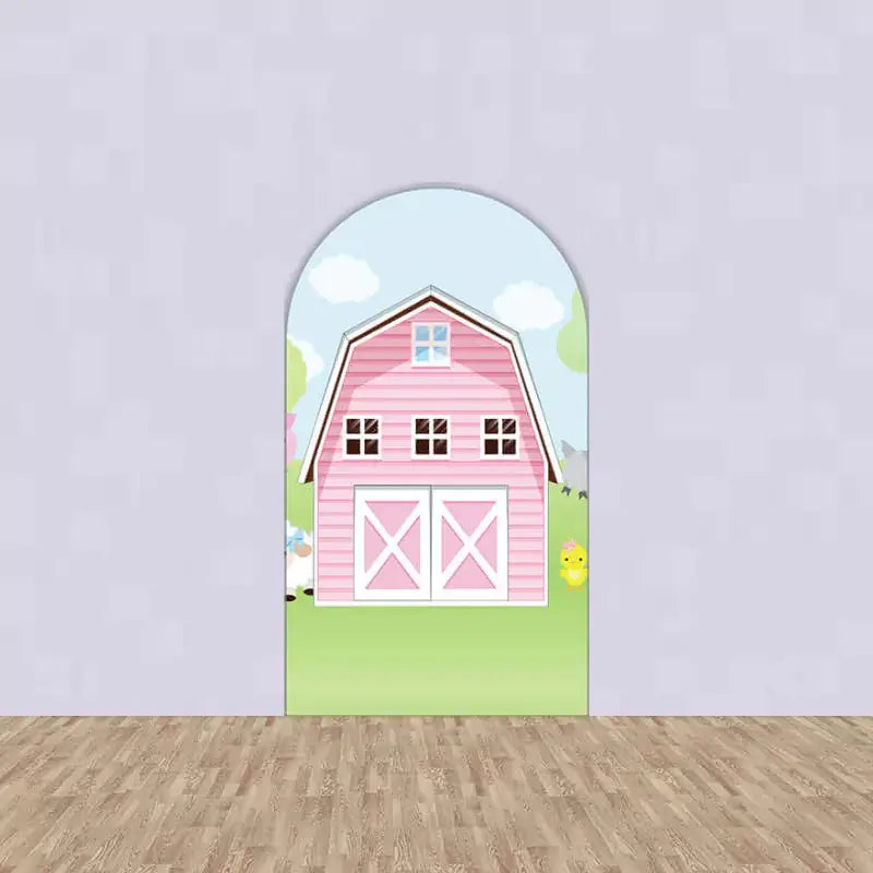 Center arch featuring a large pink barn with white doors and windows – a sweet and simple farm party background centerpiece.