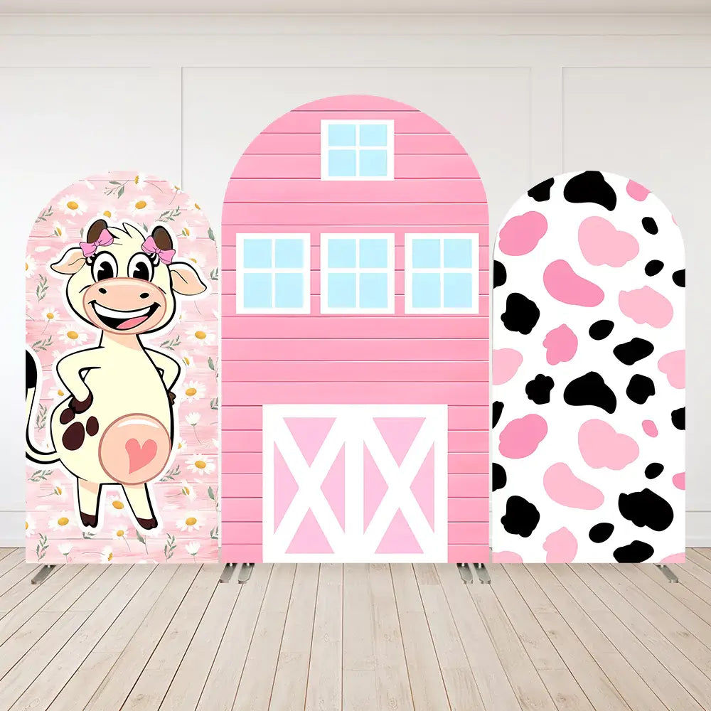 Pink barnyard backdrop with a cartoon cow, a pink barn, and cow print design, perfect for farm-themed parties.