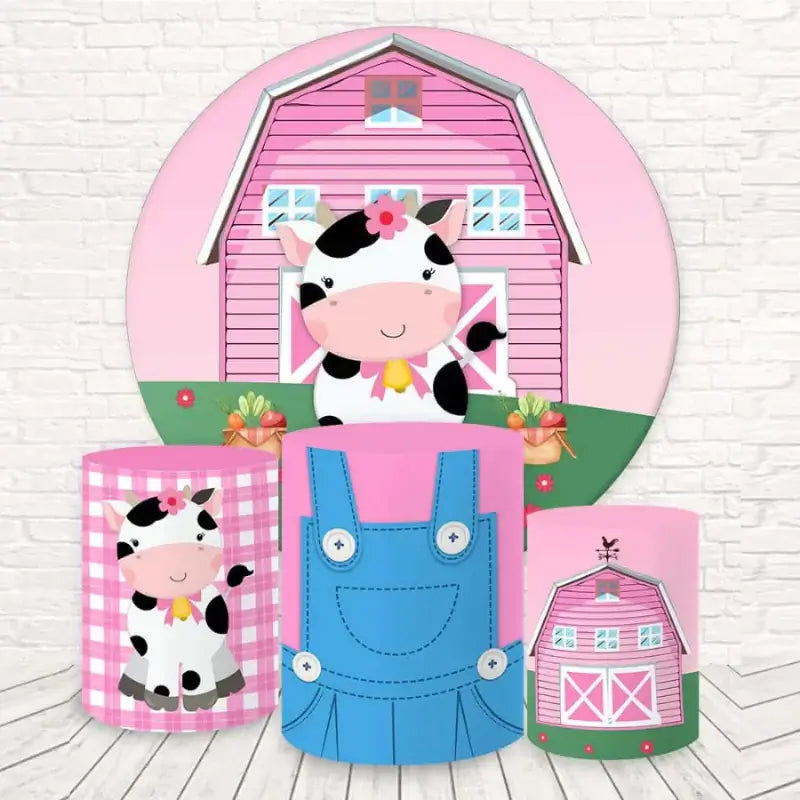 Round backdrop with a cow and pink barn, paired with three cylindrical covers featuring cow, barn, and overalls patterns, perfect for farm-themed kids' parties and baby showers.