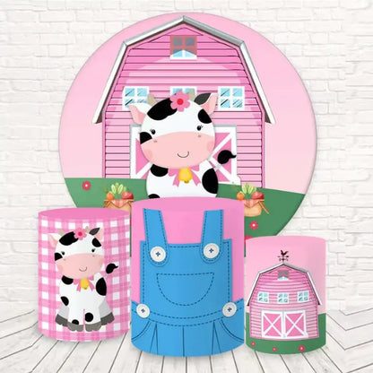 Round backdrop with a cow and pink barn, paired with three cylindrical covers featuring cow, barn, and overalls patterns, perfect for farm-themed kids' parties and baby showers.