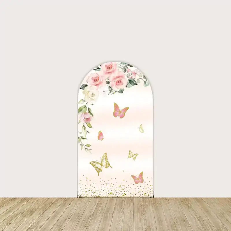 Arch panel with cascading pink and white roses, gold and pink butterflies, and soft blush ombré background—romantic Sweet 16 party decor.