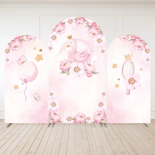 Three-piece arch backdrop with a sleeping pink swan wearing a crown, pink floral borders, star accents, balloon, and mirror—perfect for princess-themed parties.
