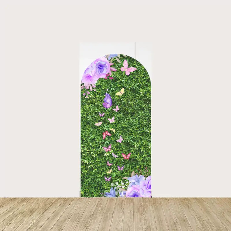 Arch panel with a butterfly trail over lush green hedge background and purple flowers—perfect for whimsical spring party decor.