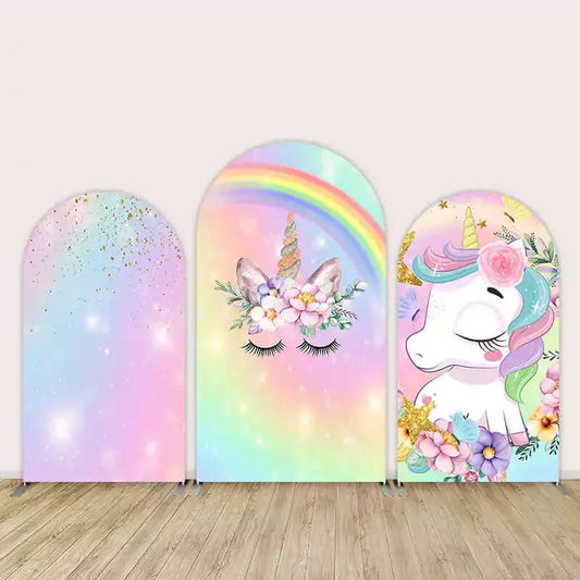 Three-piece arch backdrop set featuring a rainbow unicorn with pastel colors, sparkles, floral crown, and closed eyes design for girls’ party decor.