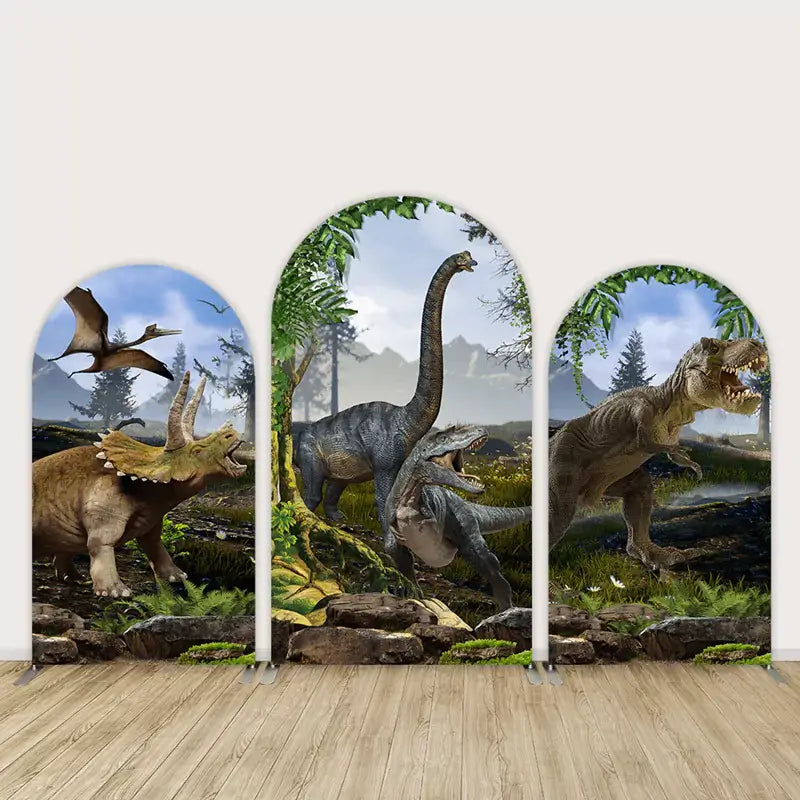 Three-panel arch backdrop featuring lifelike dinosaurs including T-Rex, Brachiosaurus, Triceratops, and flying Pterodactyls in a lush Jurassic forest.